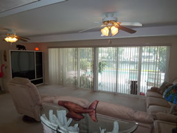 The Florida room focuses on the pool and water view